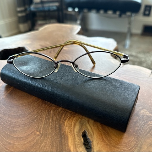 modo Accessories - modo Sleek Black and Gold frames with oval Design with RX lenses